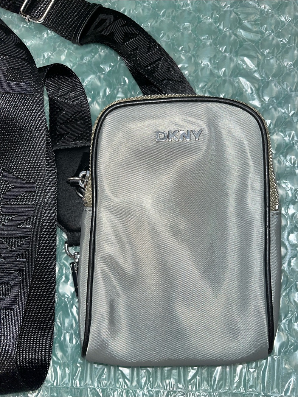 DKNY Silver Men’s Crossbody Belt Bag with Black Logo Strap
